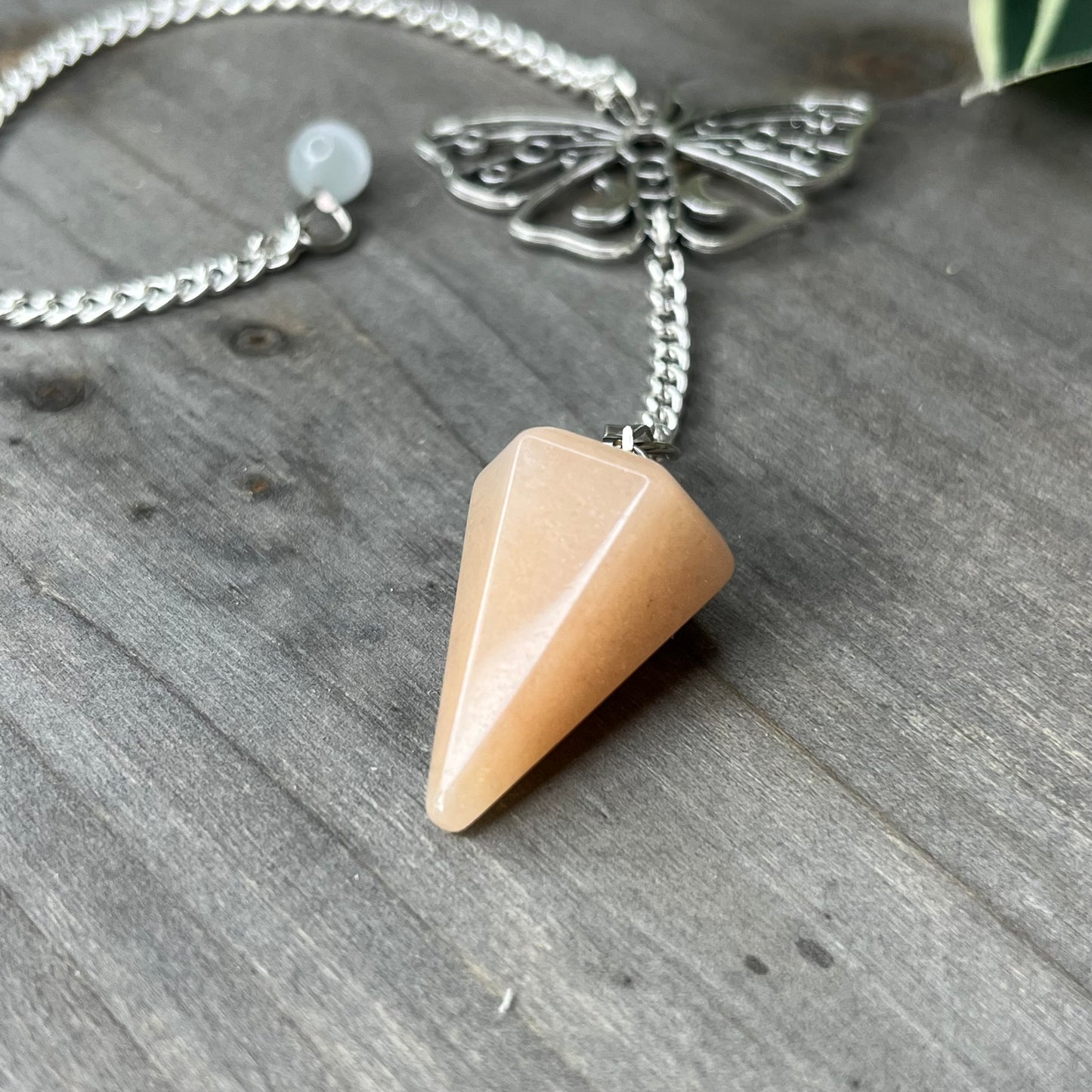 orange calcite pendulum