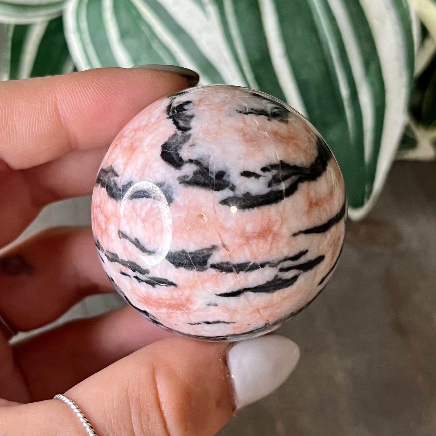 small pink zebra jasper sphere